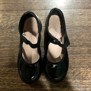 Capezio tap shoes. Black with attached strap. Size 11. Used for one season only!